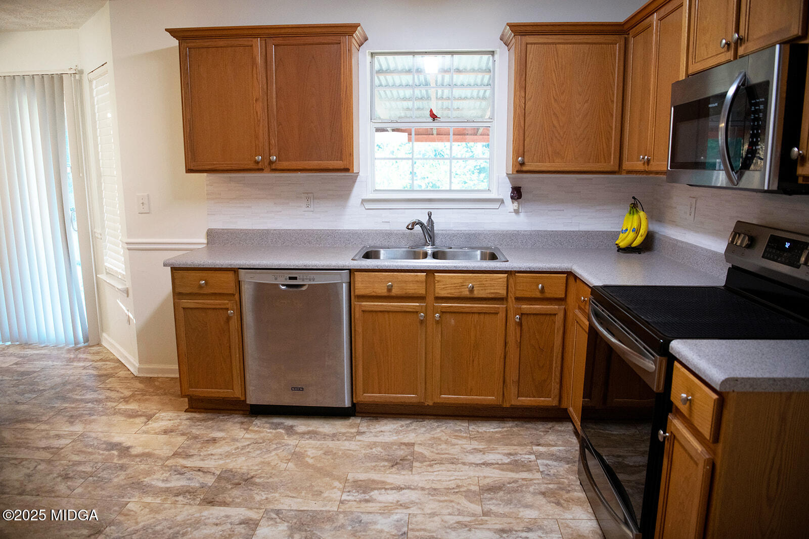 106 Meadow View Drive Jackson, GA 30233 - Photo 8 of 40 a kitchen with a sink stove top oven and cabinets