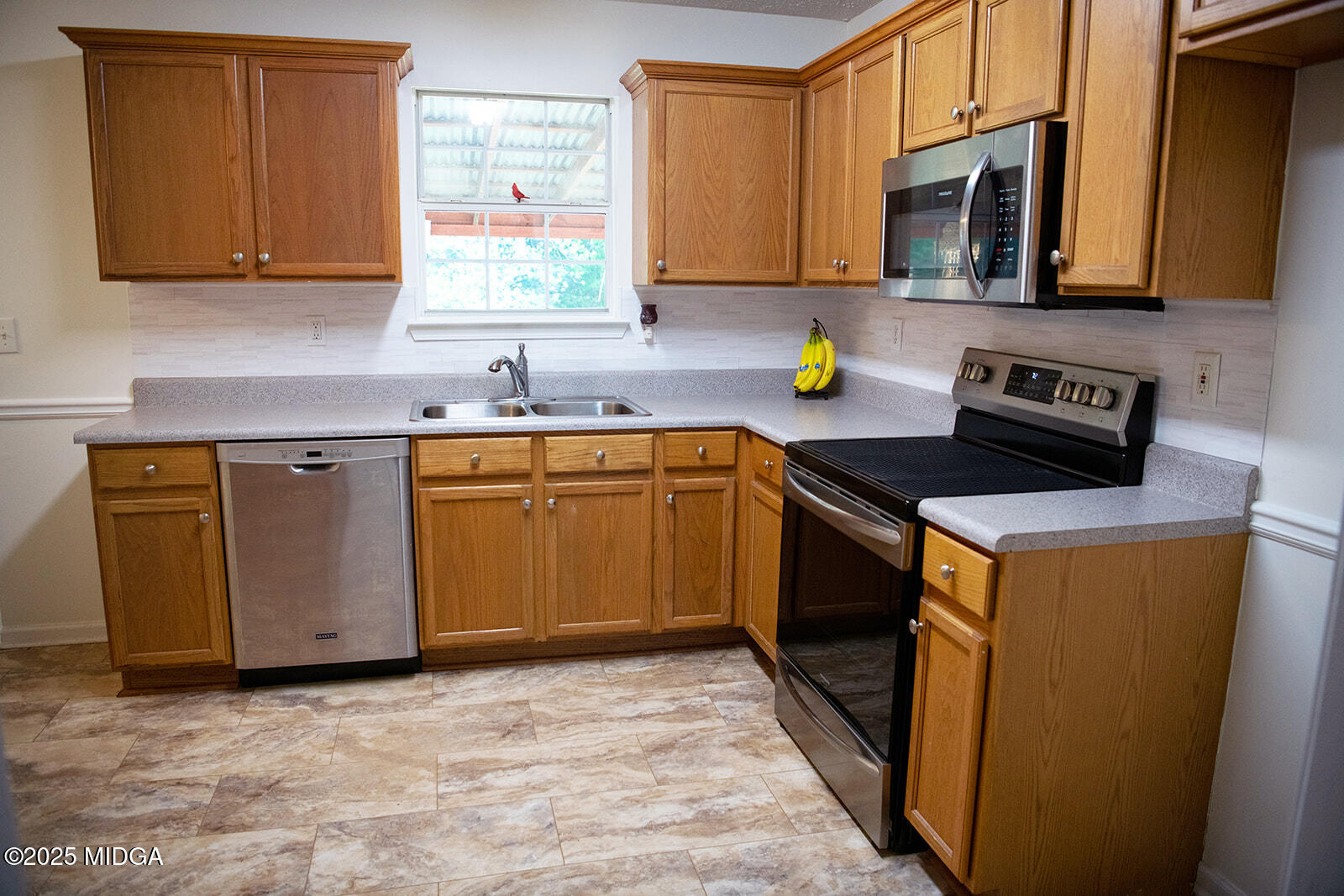 106 Meadow View Drive Jackson, GA 30233 - Photo 9 of 40 a kitchen with stainless steel appliances granite countertop a stove a sink and a microwave