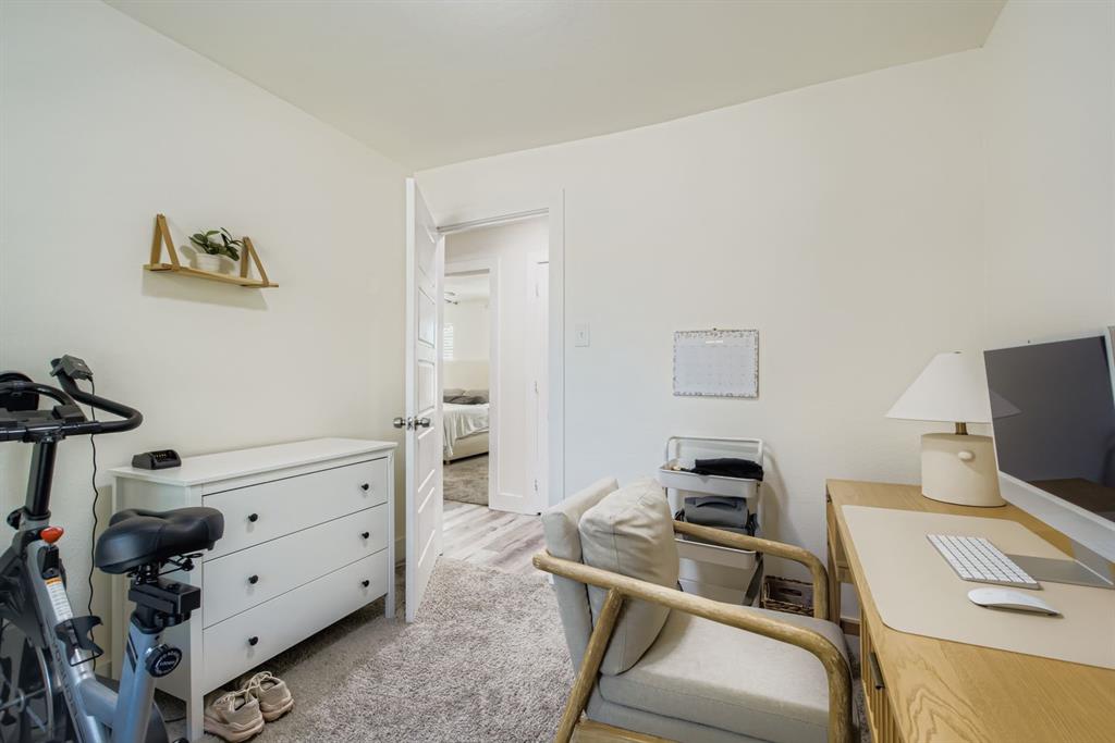1601 Rindie Street Irving, TX 75060 - Photo 14 of 29 a bedroom with a workspace