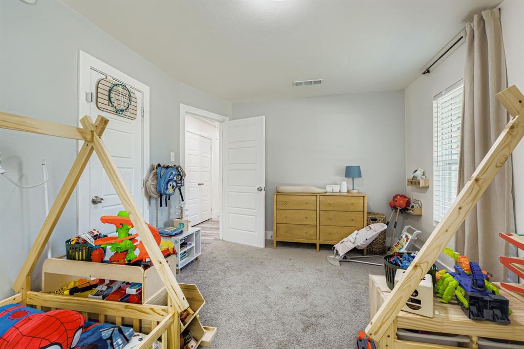 1601 Rindie Street Irving, TX 75060 - Photo 18 of 29 a room with toys and a wooden floor