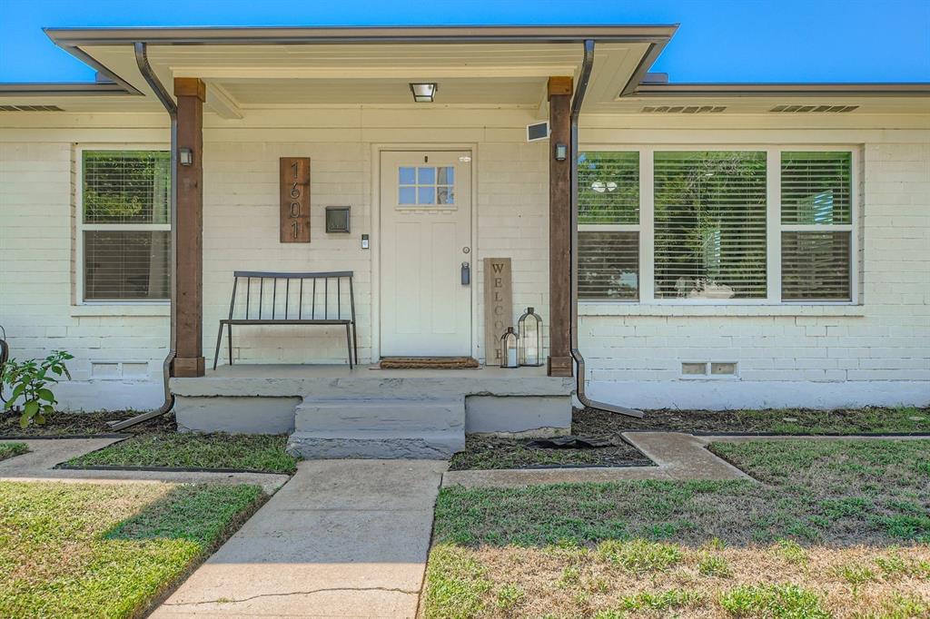1601 Rindie Street Irving, TX 75060 - Photo 22 of 29 a front view of a house with garden