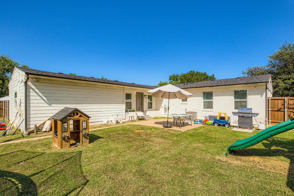1601 Rindie Street Irving, TX 75060 - Photo 24 of 29 a view of a house with backyard and sitting area