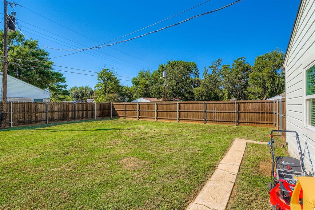 1601 Rindie Street Irving, TX 75060 - Photo 26 of 29 a view of a backyard with wooden fence