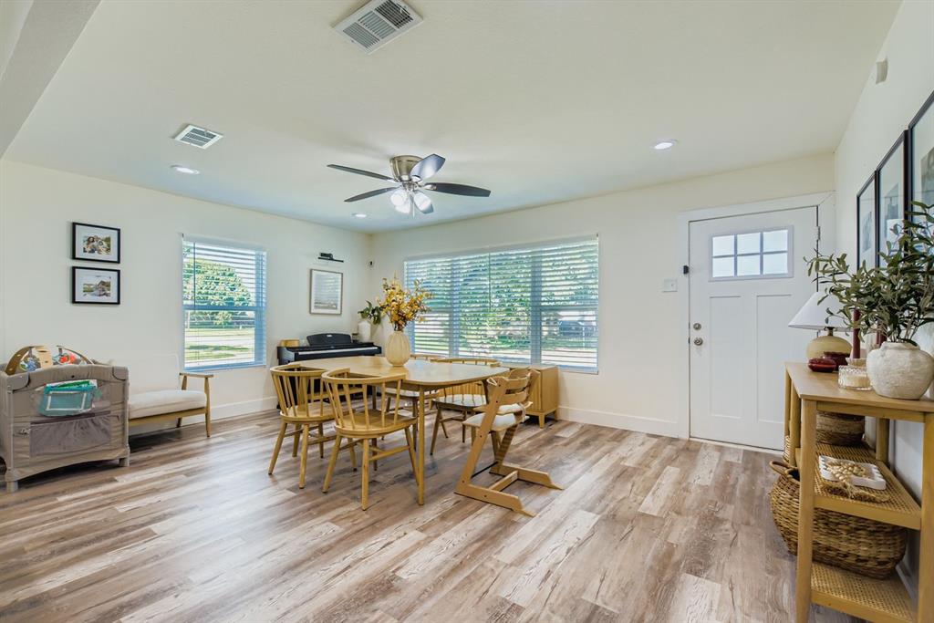 1601 Rindie Street Irving, TX 75060 - Photo 4 of 29 a view of a dining room with furniture window and wooden floor