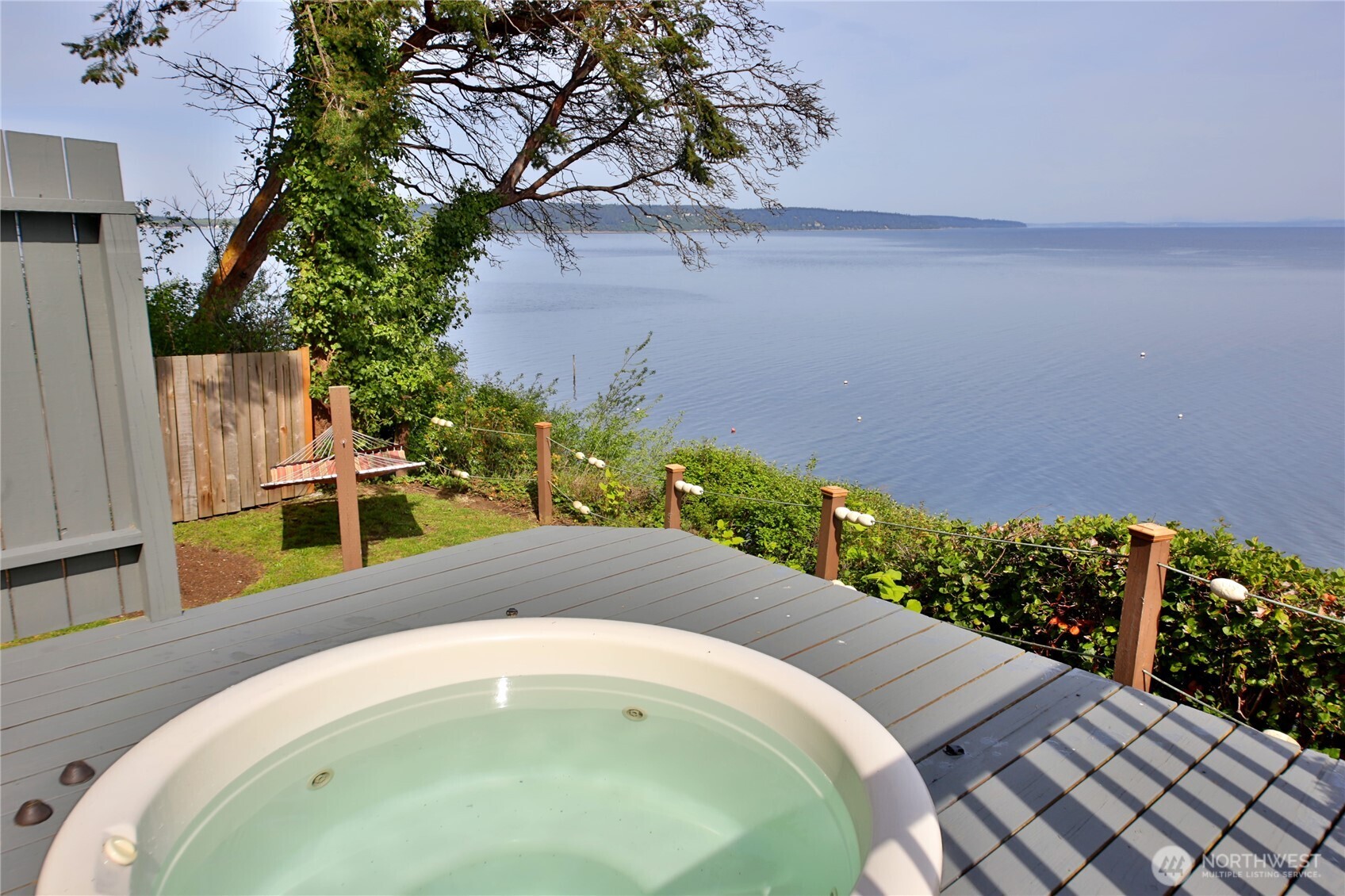 2999 Saratoga Road Langley, WA 98260 - Photo 4 of 40 a swimming pool with trees in the background