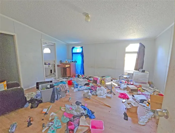 a bed room with a bed a window and couch