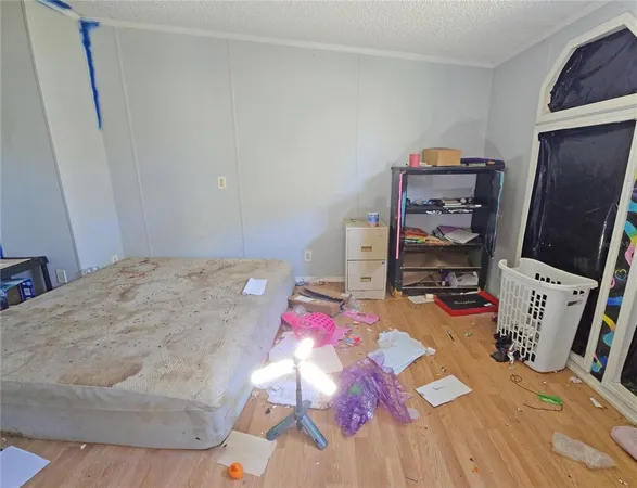 a bedroom with a bed and a couch