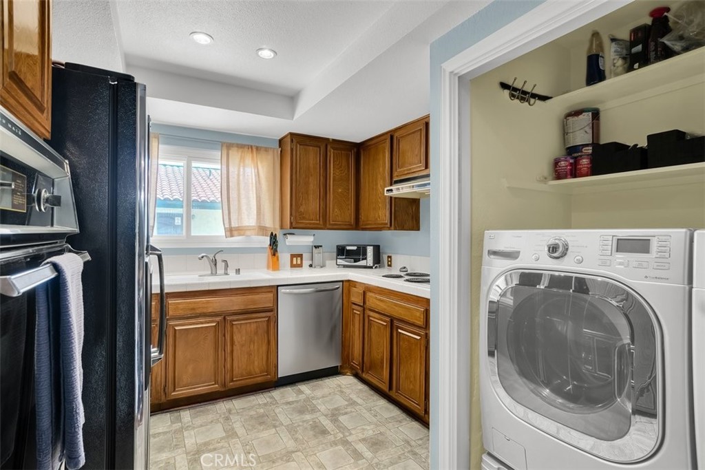 745 Main Street, Unit 107 El Segundo, CA 90245 - Photo 14 of 38 a view of a kitchen with sink washer and dryer