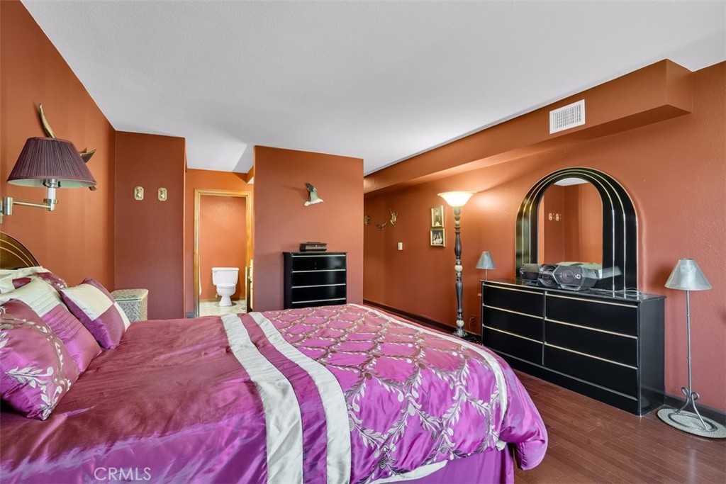 745 Main Street, Unit 107 El Segundo, CA 90245 - Photo 20 of 38 a bed room with a bed and dresser