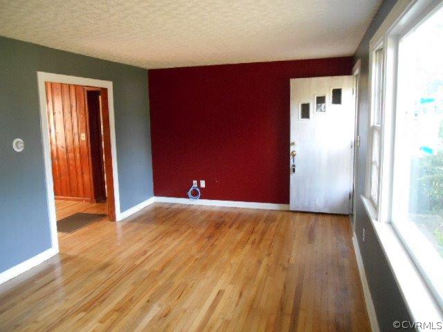 4118 Turner Road Chesterfield, VA 23832 - Photo 3 of 17 a view of an empty room with wooden floor and a window