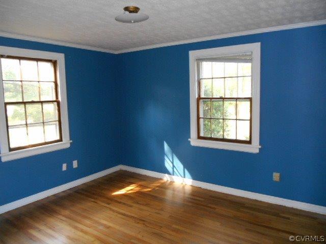 4118 Turner Road Chesterfield, VA 23832 - Photo 10 of 17 an empty room with wooden floor and windows