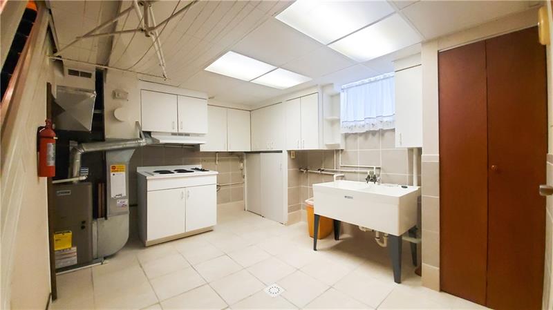 700 Filmore Road Pittsburgh, PA 15221 - Photo 14 of 25 Basement with additional cooking stove top.