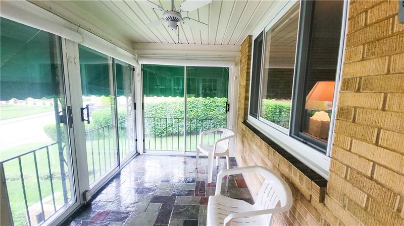 700 Filmore Road Pittsburgh, PA 15221 - Photo 22 of 25 Front three seasons room. All the doors open to let the fresh air in!