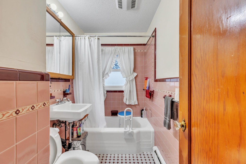 513 Springfield Street Chicopee, MA 01013 - Photo 17 of 38 a bathroom with a sink toilet and shower