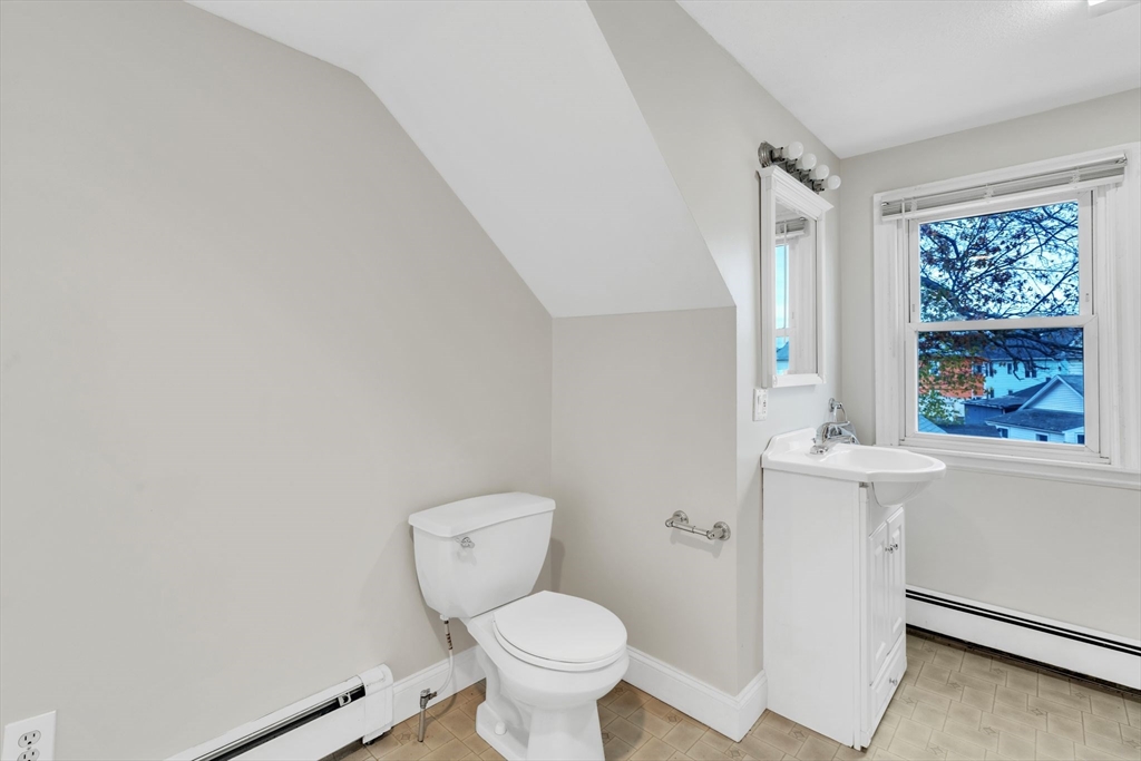 513 Springfield Street Chicopee, MA 01013 - Photo 24 of 38 a white toilet sitting next to a window