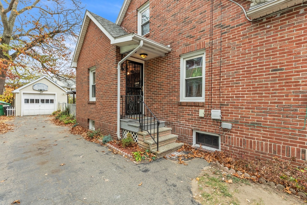 513 Springfield Street Chicopee, MA 01013 - Photo 38 of 38 a view of a brick house with many windows