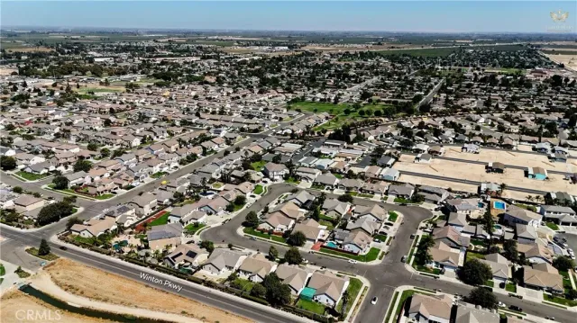 an aerial view of a residential houses with outdoor space