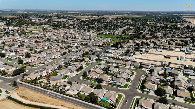 an aerial view of a residential houses with city view