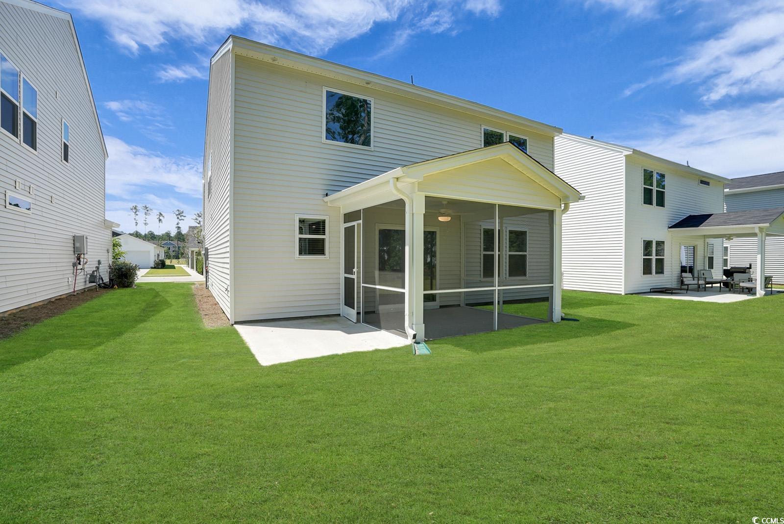 1113 Hainer Place Drive Conway, SC 29526 - Photo 28 of 28 Back of property with a patio, a yard, and a sunroom