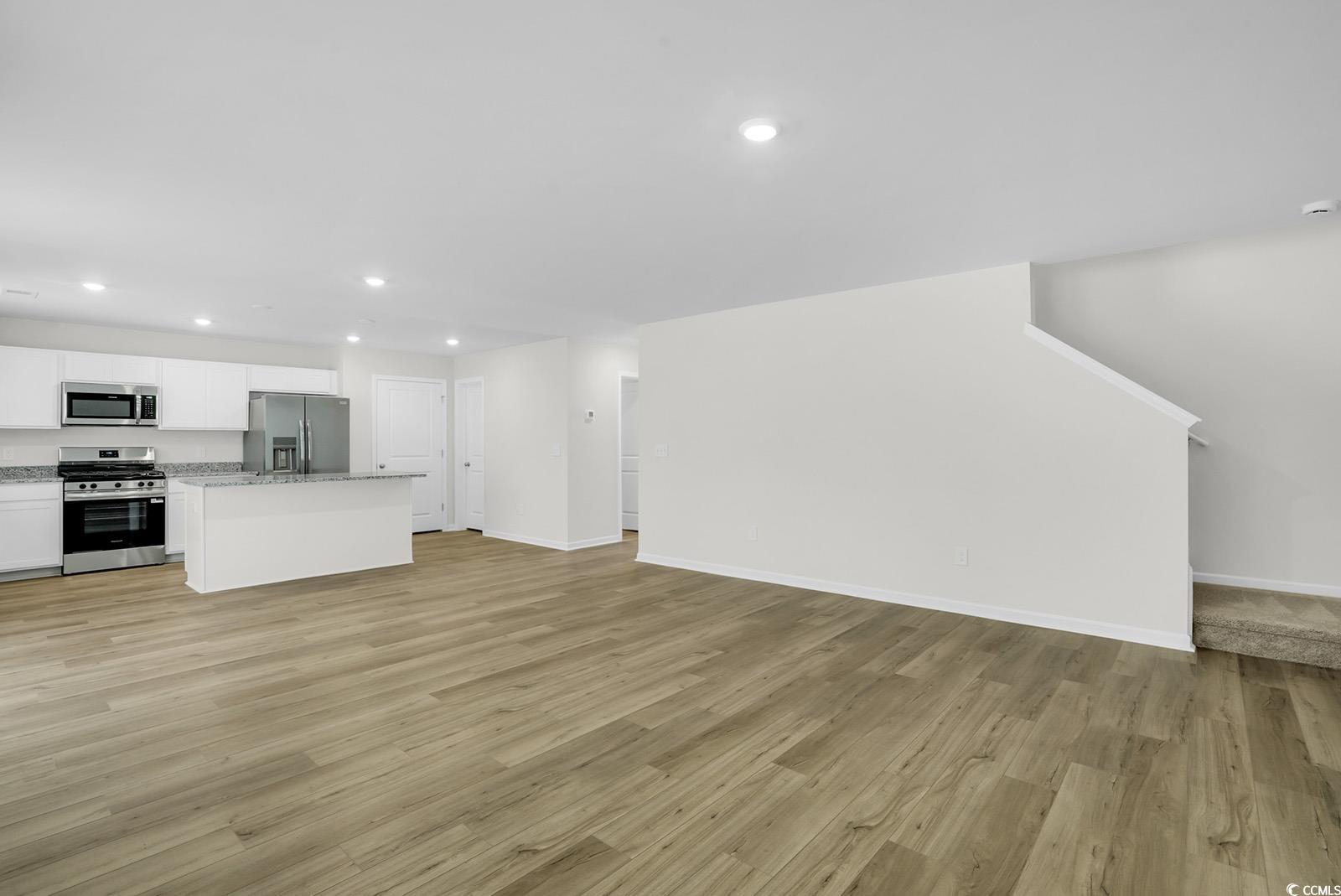 1113 Hainer Place Drive Conway, SC 29526 - Photo 7 of 28 Unfurnished living room featuring light wood-style floors and recessed lighting