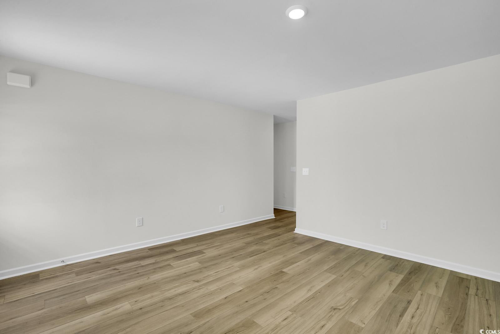 1113 Hainer Place Drive Conway, SC 29526 - Photo 10 of 28 Spare room featuring light wood-type flooring and baseboards