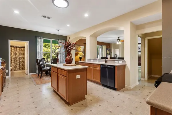 a kitchen with sink cabinets and dining table