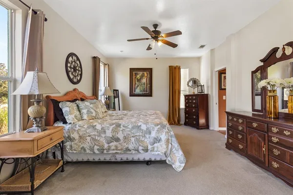 a bathroom with a sink mirror and a shower