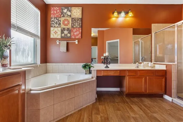 a spacious bathroom with a sink double vanity and a mirror