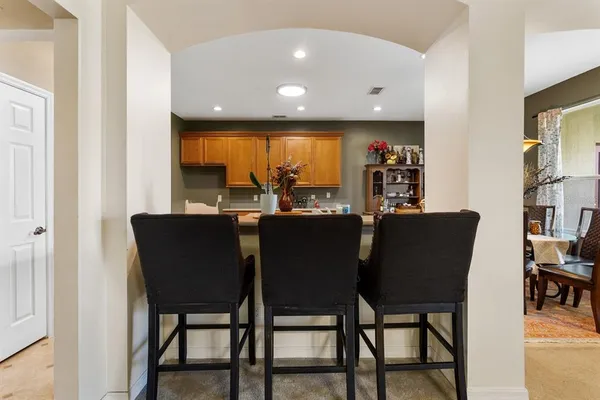 a view of a dining room with furniture and window