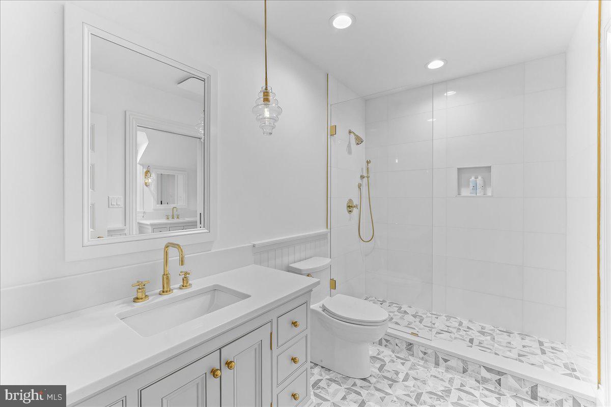 80 Heyburn Road Chadds Ford, PA 19317 - Photo 55 of 76 a bathroom with a sink toilet vanity and shower
