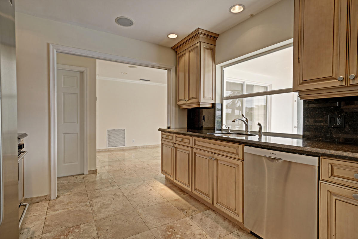 5600 Nassau Drive Boca Raton, FL 33487 - Photo 13 of 21 a large kitchen with cabinets