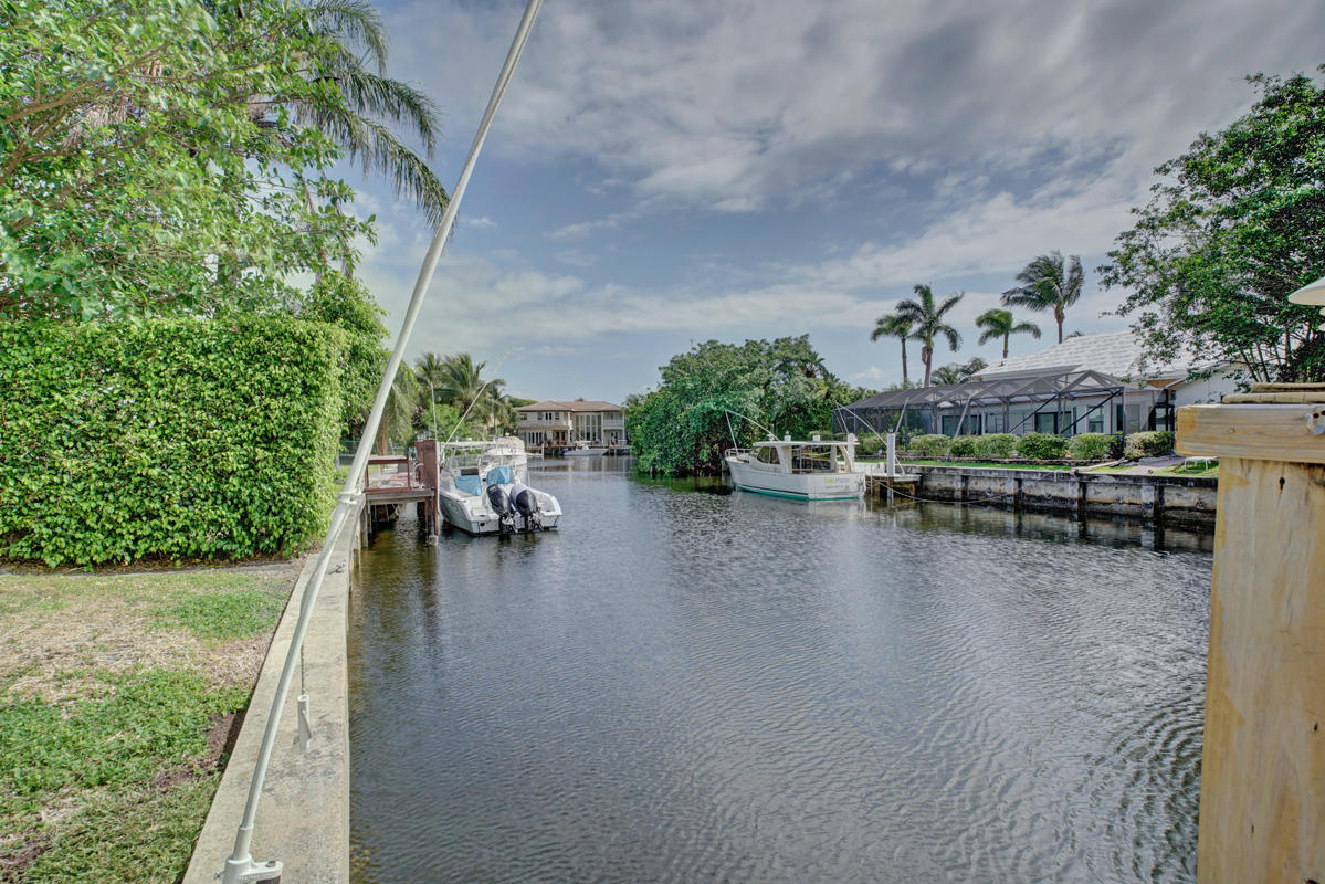 5600 Nassau Drive Boca Raton, FL 33487 - Photo 6 of 21 a view of a lake with sitting area