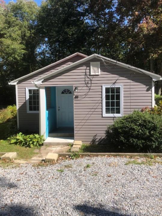 41 Spring Glen Road East Lyme, CT 06357 - Photo 1 of 1 a front view of a house with garden