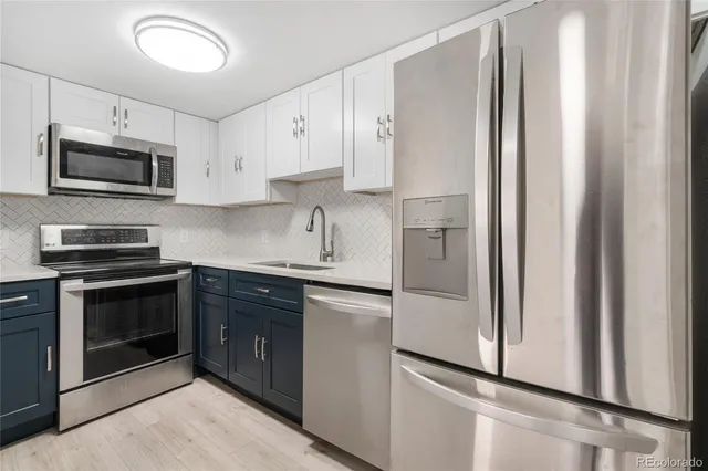 a kitchen with a sink and cabinets
