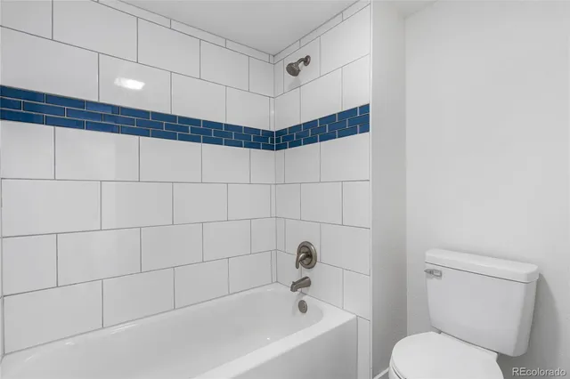 a building outdoor space with patio furniture and potted plants