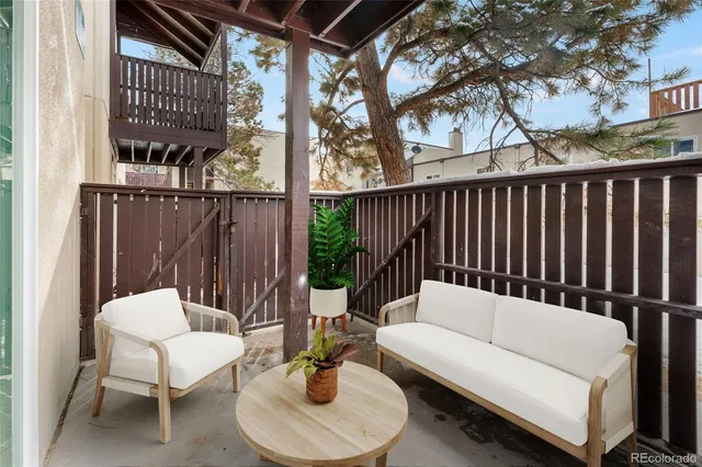 a view of a porch with wooden floor
