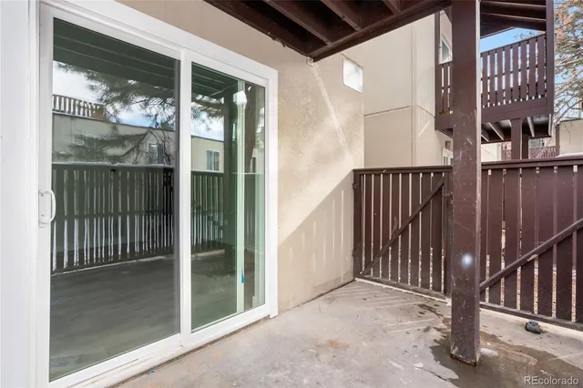 a front view of a house with a yard covered in snow