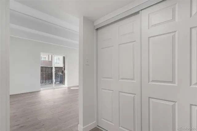 a dining room with furniture and a potted plant