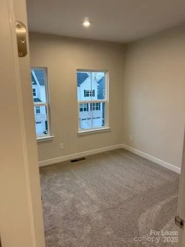 a kitchen with stainless steel appliances a refrigerator sink and microwave