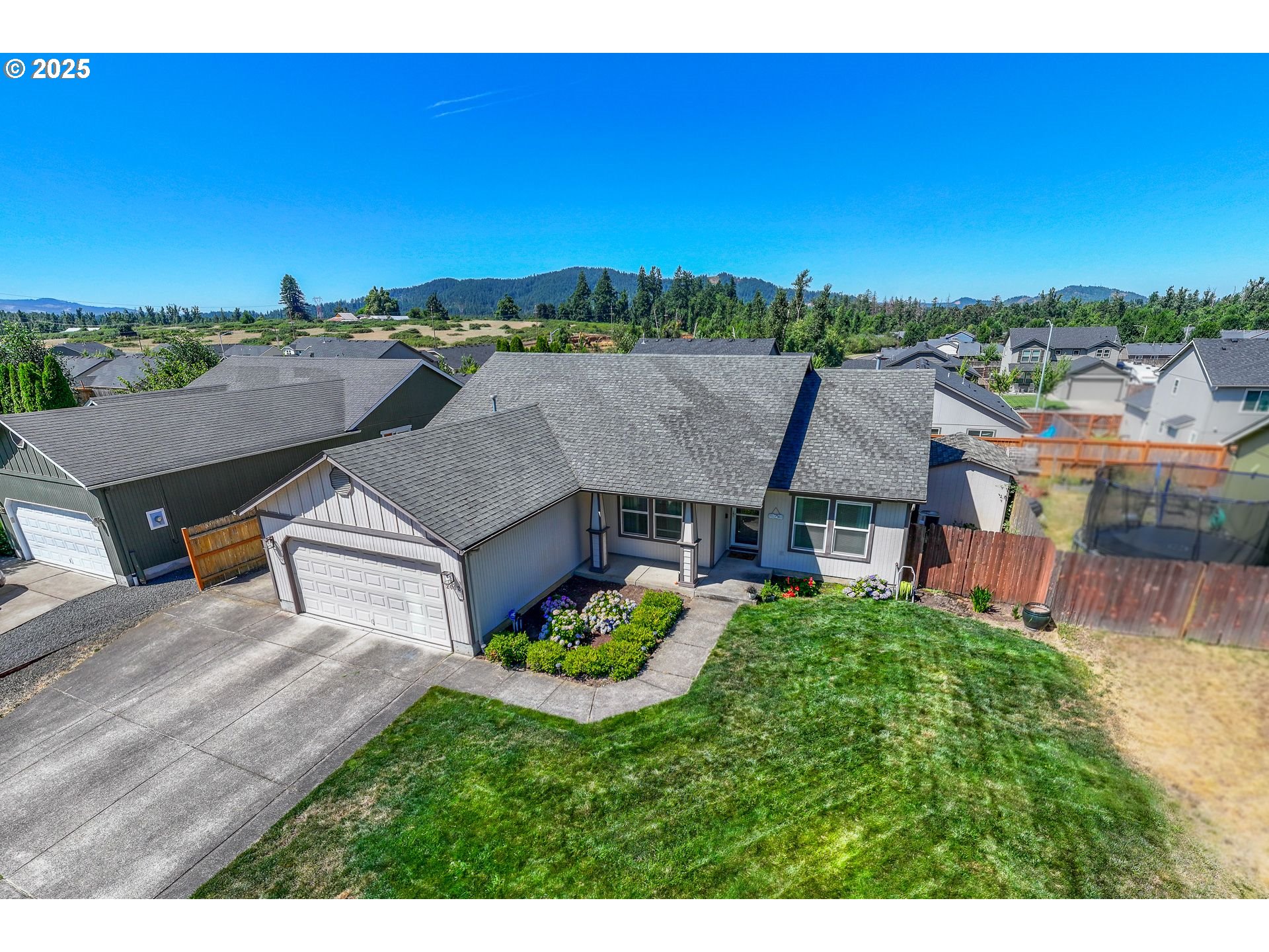 2002 South 60th Street Springfield, OR 97478 - Photo 1 of 47 a aerial view of a house with a garden and a yard