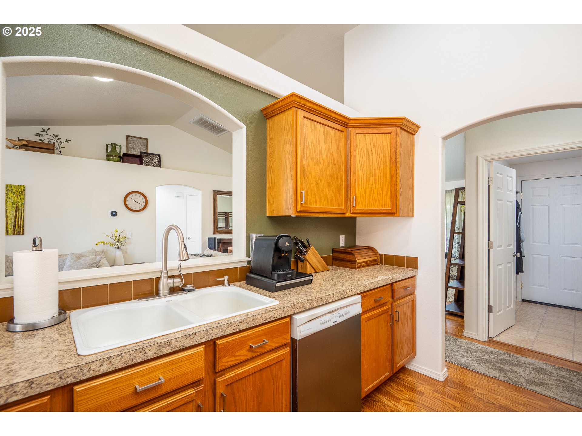 2002 South 60th Street Springfield, OR 97478 - Photo 13 of 47 a kitchen with a sink a refrigerator and cabinets