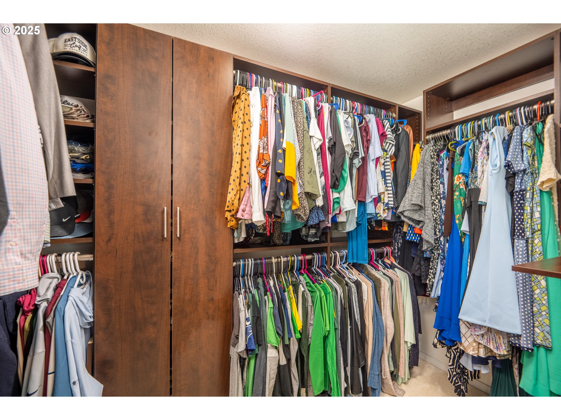 2002 South 60th Street Springfield, OR 97478 - Photo 18 of 47 a view of walk in closet with clothes and shoes