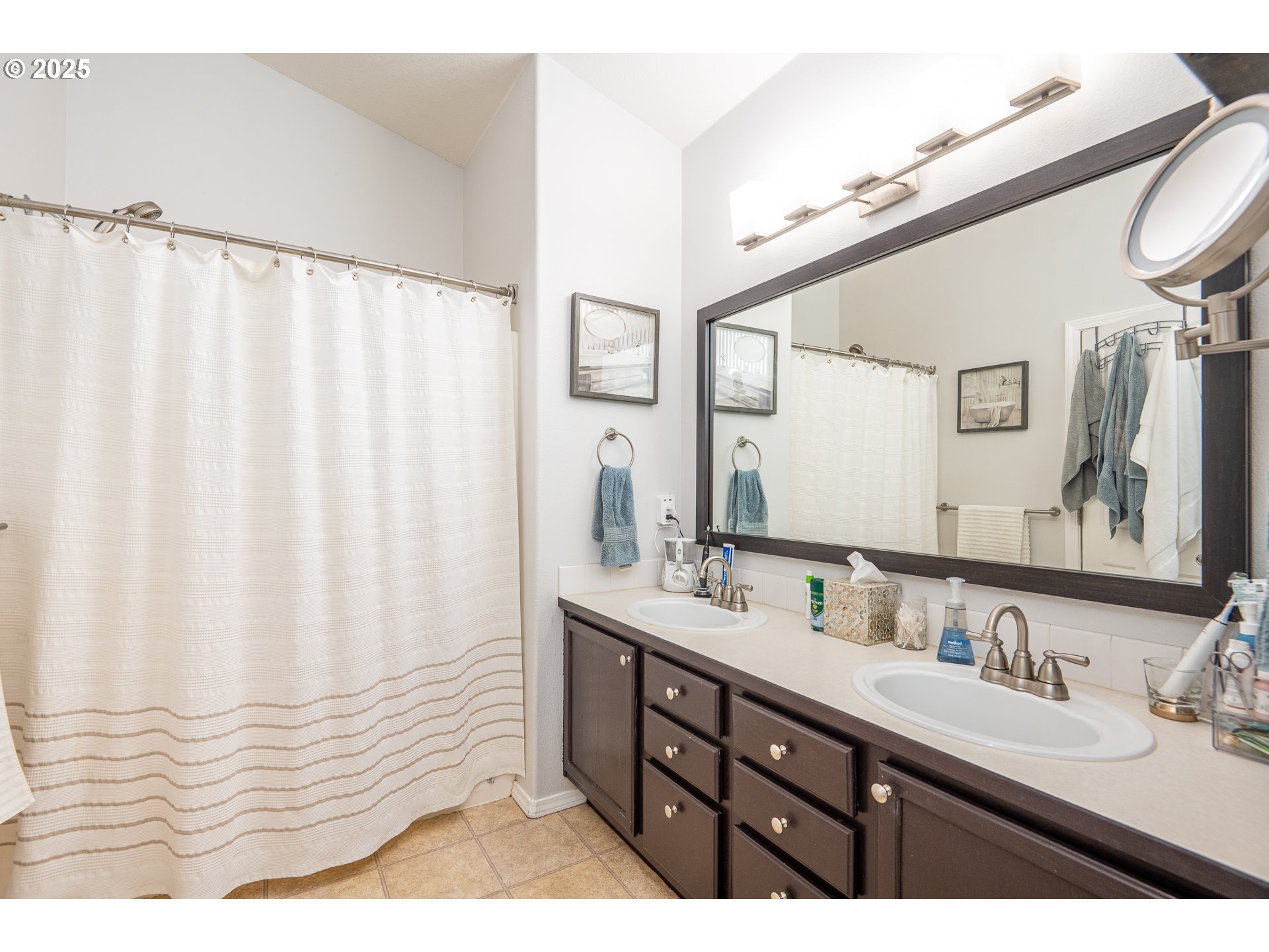 2002 South 60th Street Springfield, OR 97478 - Photo 19 of 47 a bathroom with a double vanity sink and mirror