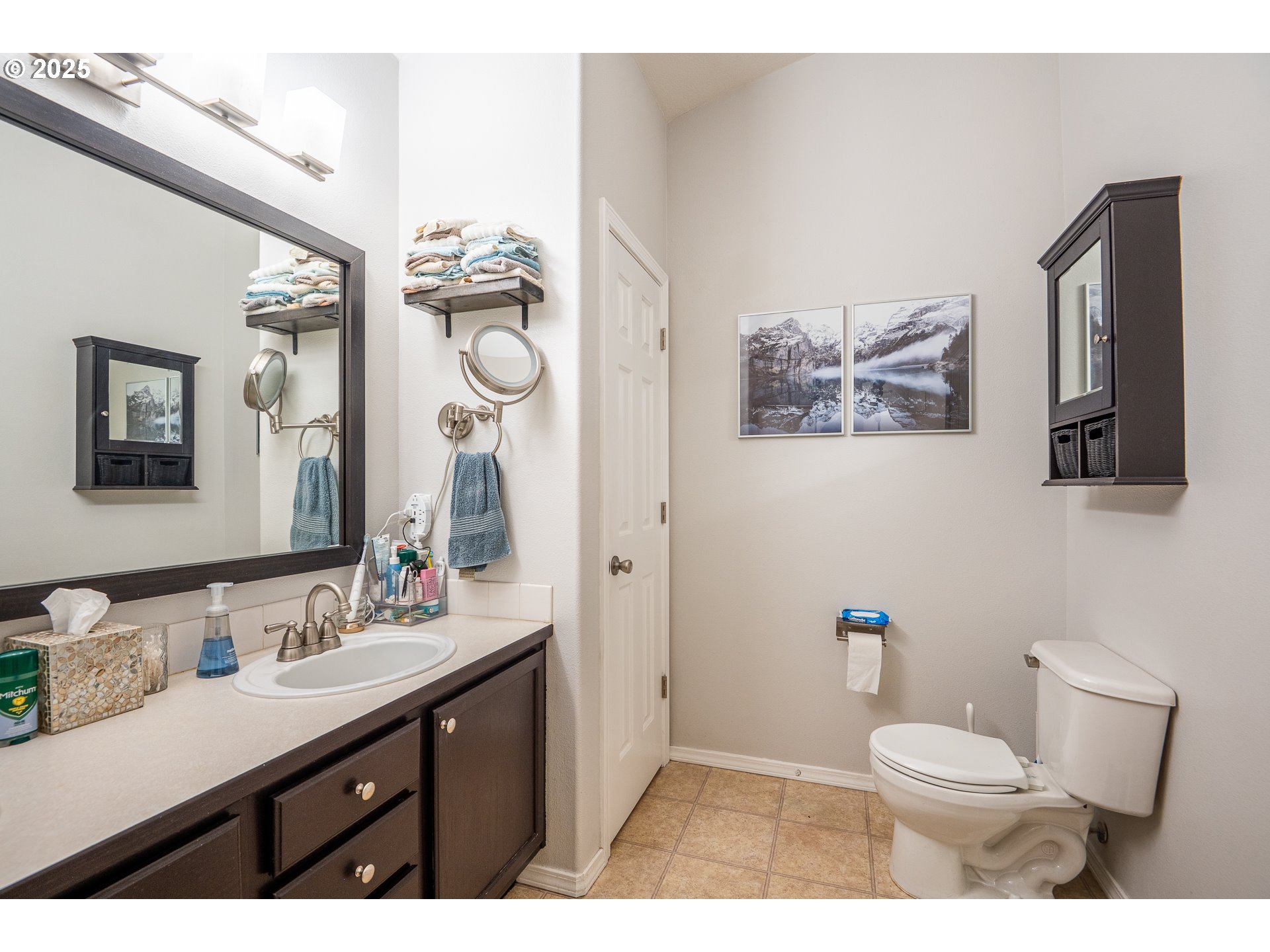 2002 South 60th Street Springfield, OR 97478 - Photo 21 of 47 a bathroom with a granite countertop toilet sink and a mirror