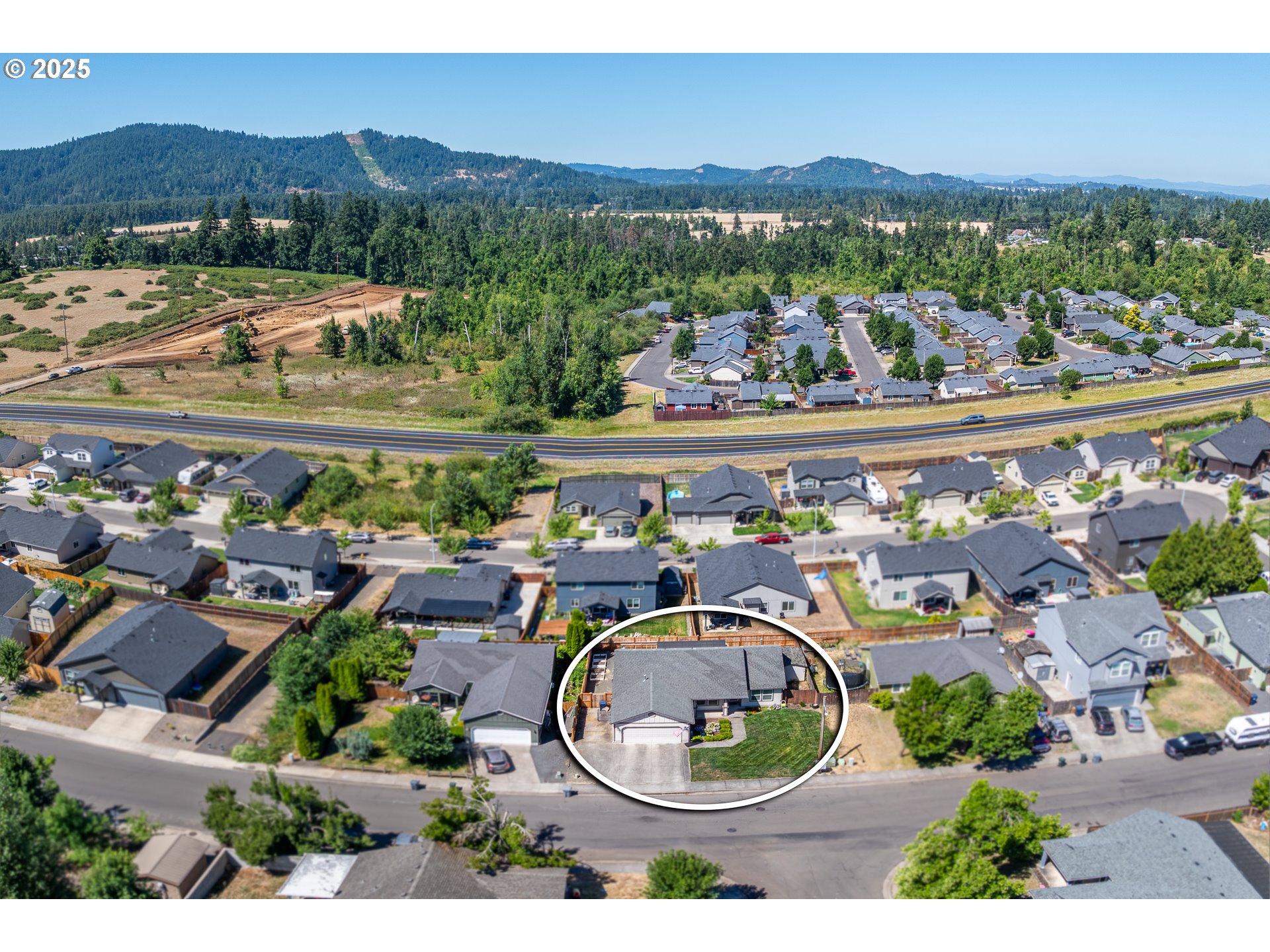 2002 South 60th Street Springfield, OR 97478 - Photo 41 of 47 an aerial view of a house with a yard and lake view