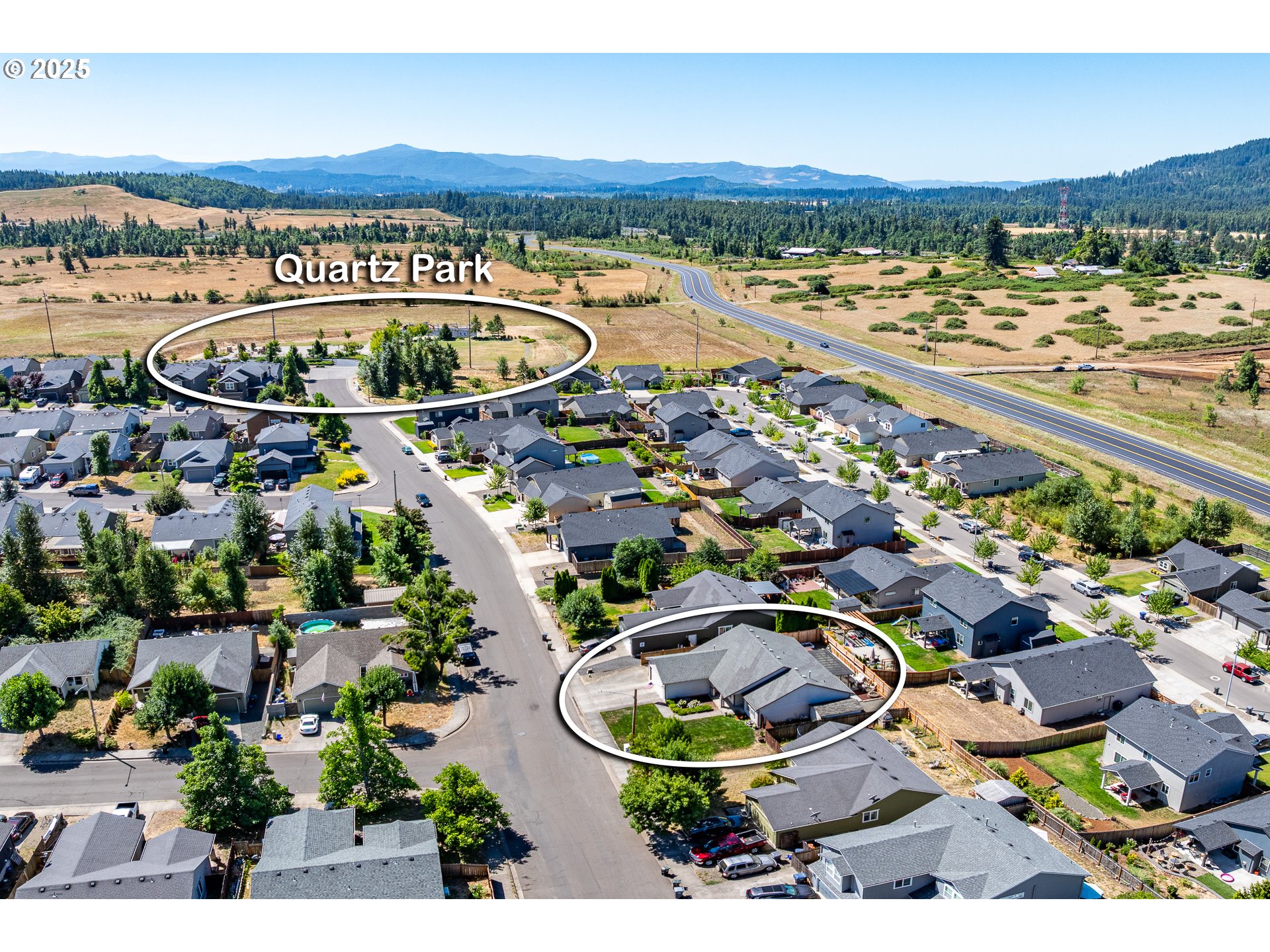 2002 South 60th Street Springfield, OR 97478 - Photo 42 of 47 an aerial view of a swimming pool and mountain