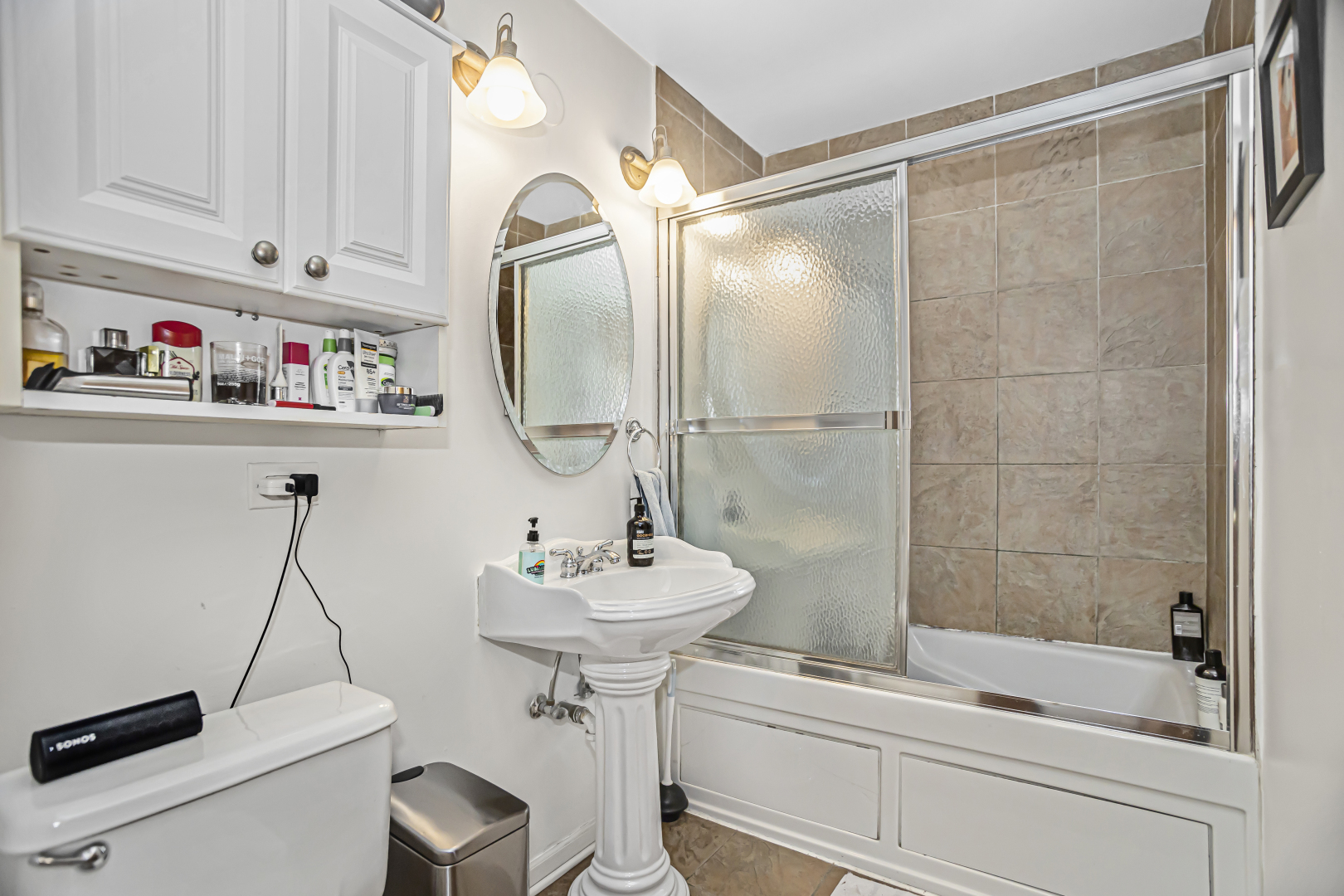 4030 North Sheridan Road, Unit 1R Chicago, IL 60613 - Photo 13 of 16 a bathroom with a sink and a mirror