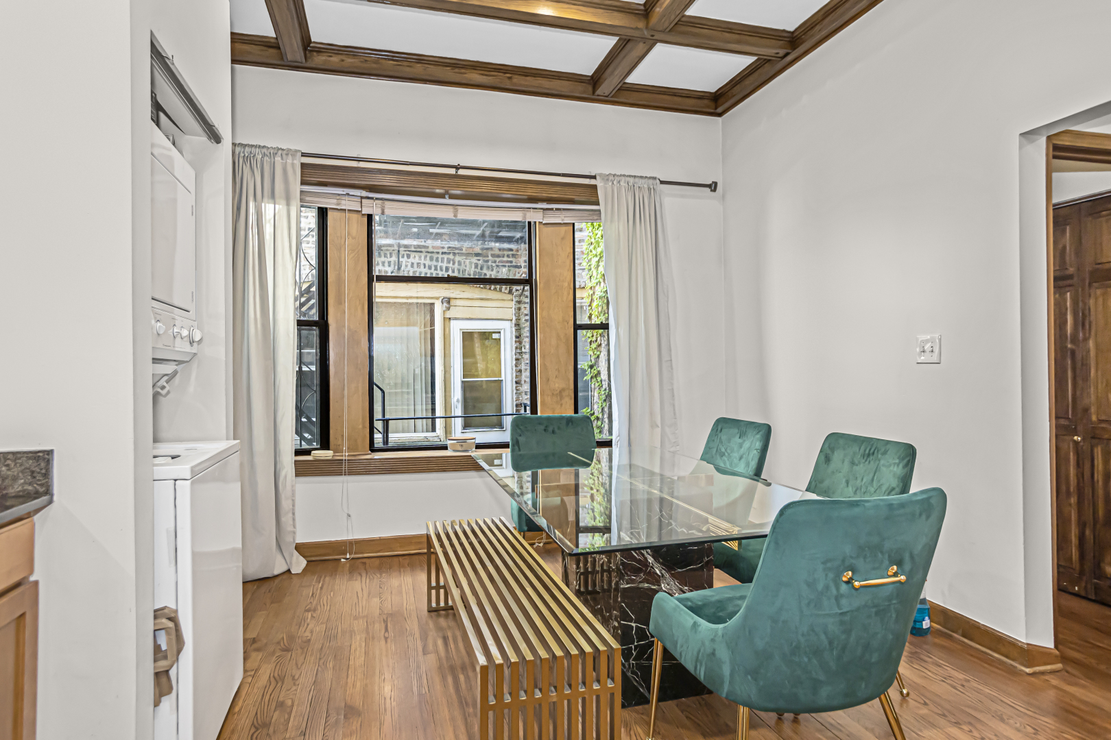 4030 North Sheridan Road, Unit 1R Chicago, IL 60613 - Photo 6 of 16 a view of a livingroom with furniture wooden floor and a window