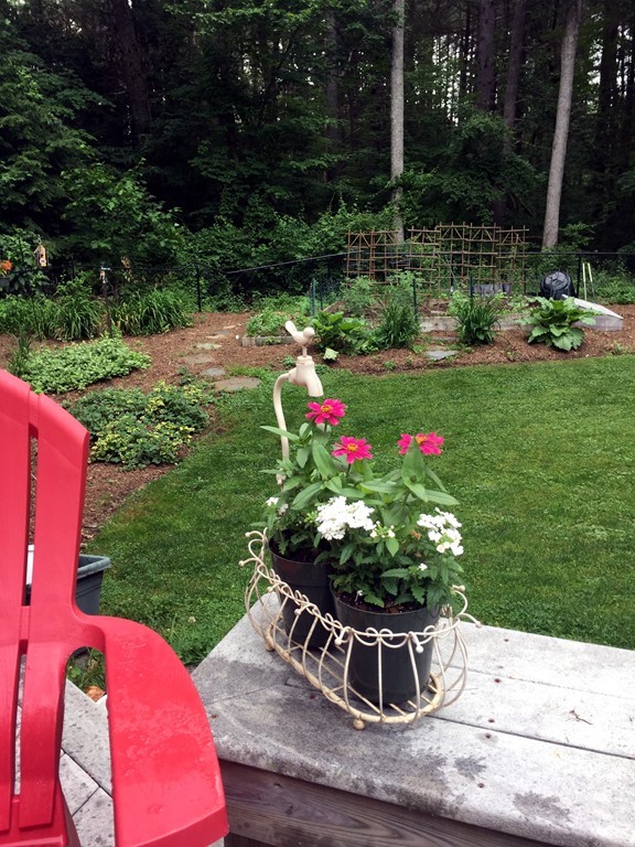 132 Aubinwood Road Amherst, MA 01002 - Photo 10 of 29 a view of a table and chairs in the garden
