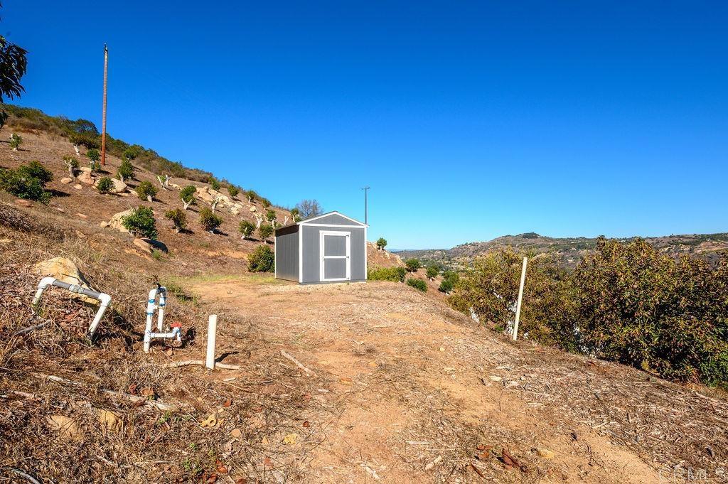 30580 Luis Rey Heights Road Bonsall, CA 92084 - Photo 8 of 8 a view of a yard with a house